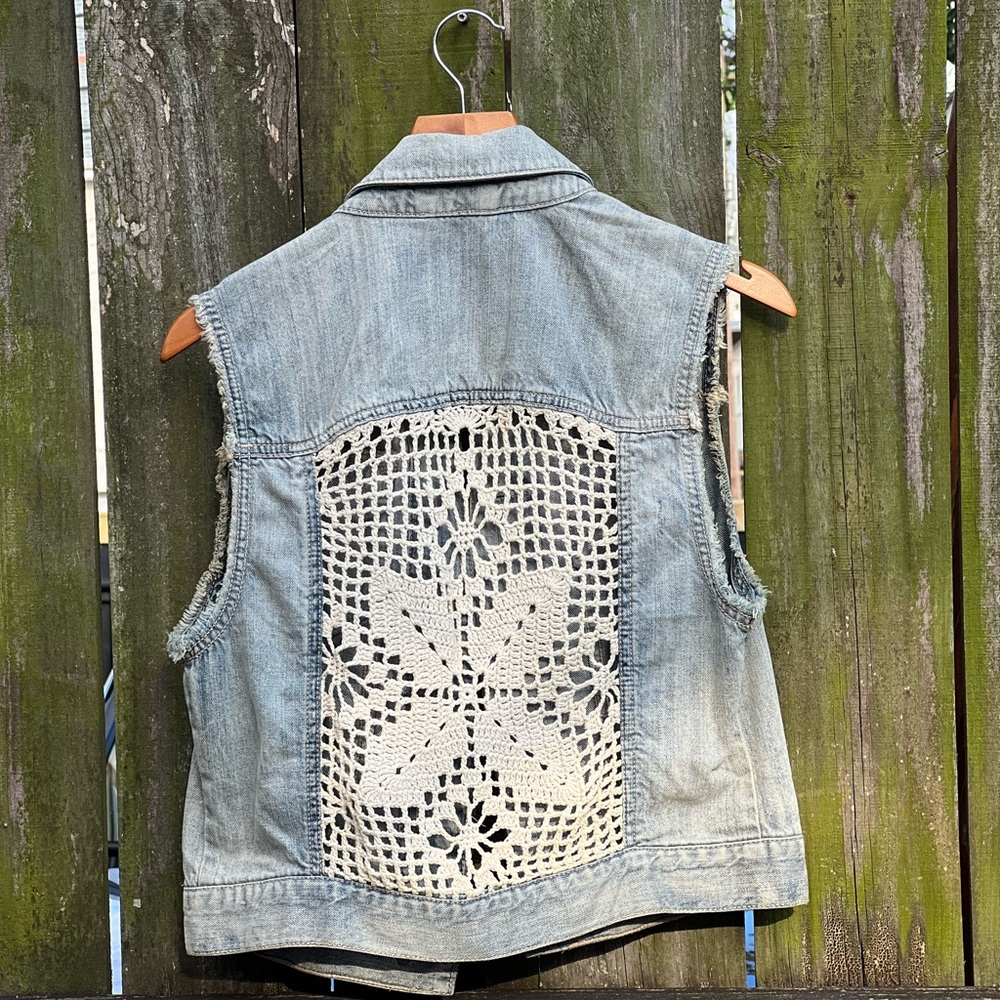 Light wash denim vest with crotchet accents